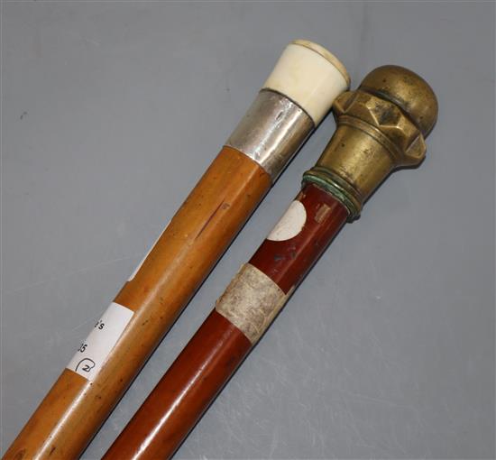 A bailiffs walking stick and sovereign case stick